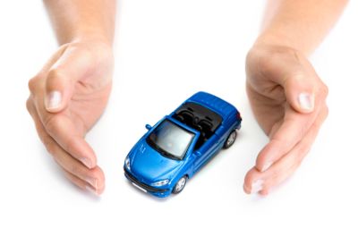 woman hands holding blue car isolated on white background