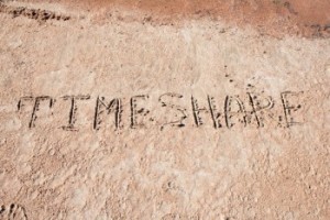 Inscription “TimeShare” on a sand.