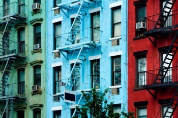 Colorful apartment buildings with fire escapes