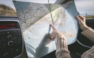 person looking at map for road trip