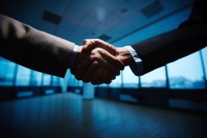 Business handshake business partner