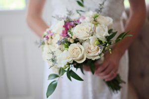 wedding dress hands flowers