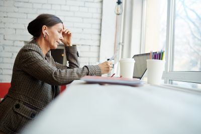 person on computer phone cooffe