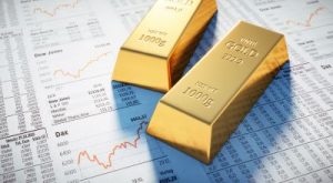 3 Goldbarren auf Börsenkursen