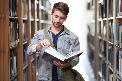 student in library